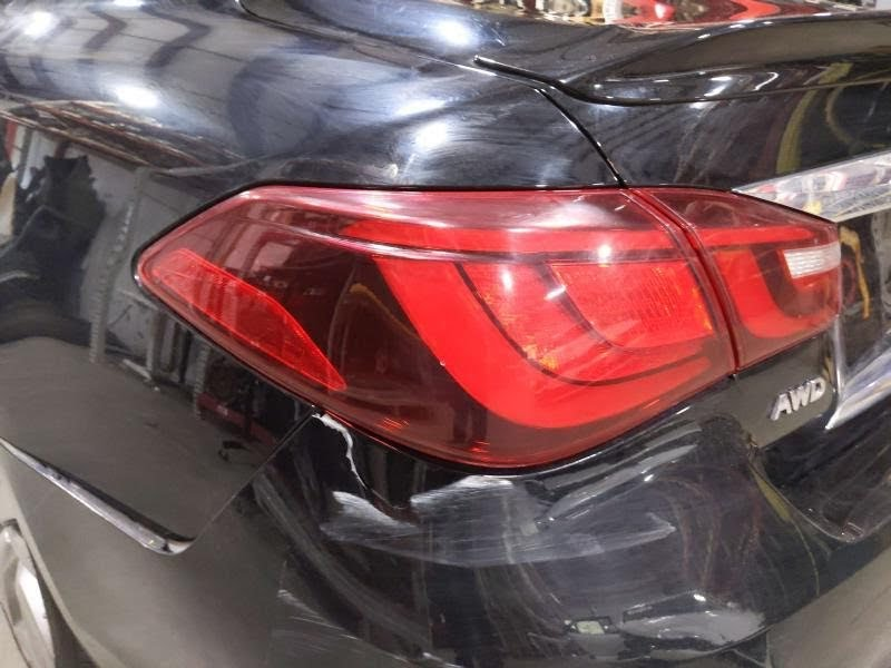 2016 INFINITI Q70 Used Tail Light  - quarter panel mounted, LH  And  Used Front Emblem