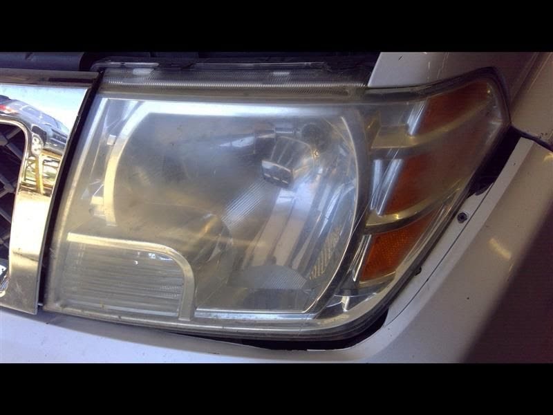 2014 Nissan Frontier Used Headlight Assembly LH